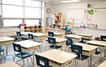 Empty desk in classroom 